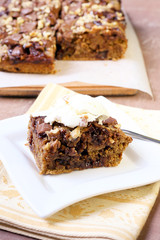 Chocolate and oat cake with nuts and ice cream