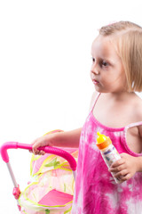 Cute little girl with her toy carriage