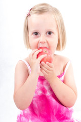 Portrait of happy child eating red apple