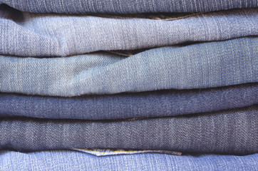 close up stack of folded jeans horizontal