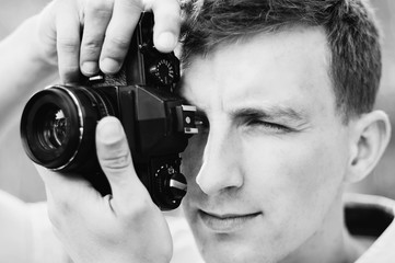 Fototapeta premium young photographer takes pictures