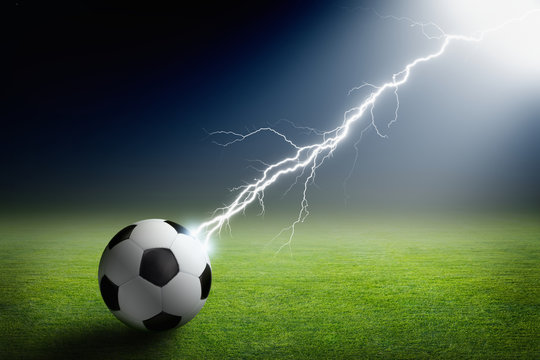 Soccer ball, lightning, spotlight