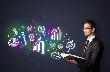 Young guy reading a book with business icons