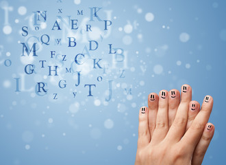 Happy smiley fingers looking at mixture of bokeh letters