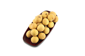 Longan in dish on white background.