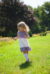 Portrait of running little girl