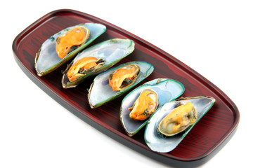 Fototapeta na wymiar Mussels on wooden dish.