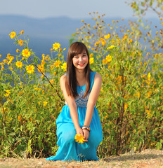 beautiful young girl in a meadow in summer