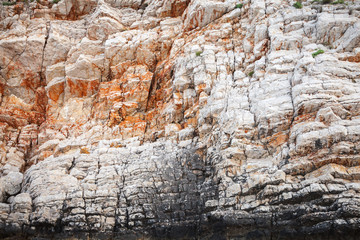 Coastal rocks background texture. Adriatic Sea