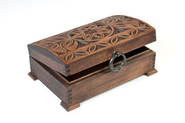 Oriental wooden jewelry box with ornaments on a white background