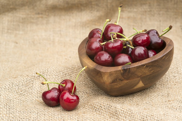 Fresh Summer cherries in wooden bowl