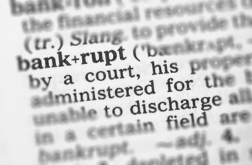 Fototapeta premium Macro image of dictionary definition of bankrupt