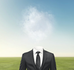 man without head on green field background