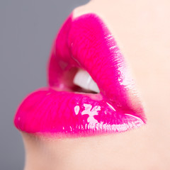 Passionate glossy lips close up