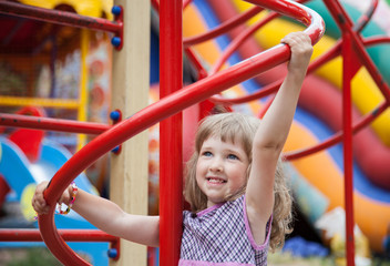 Active little girl playing in a stadium