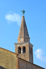 Fototapeta premium Belltower of Santa Eufemia Cathedral in Grado, Italy