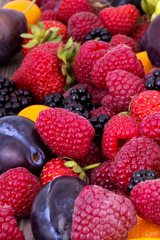 tasty summer fruits on a wooden table