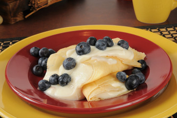 French style crepes with cream and blueberries