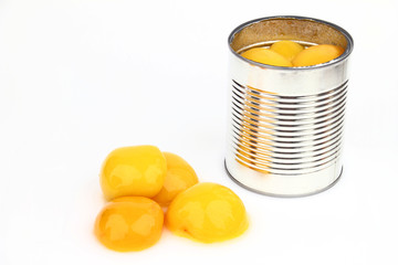 The tin with peaches  on the white background