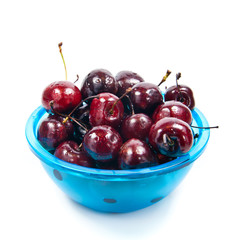 Fresh cherries in bowl isolated on white