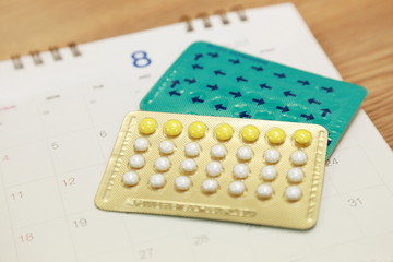 birth control pills on a calendar