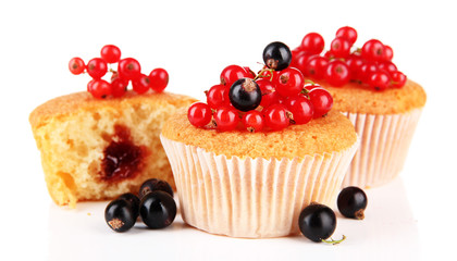 Tasty muffins with berries isolated on white
