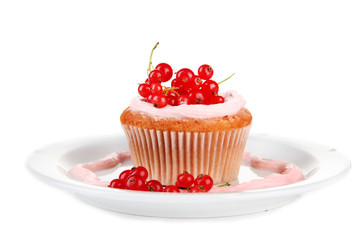 Tasty muffin with berries isolated on white