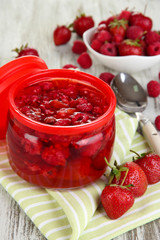 Home made berry jam on wooden table