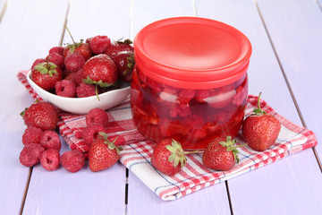 Home made berry jam on wooden table