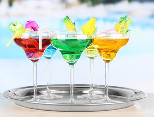 Different cocktails on bright background