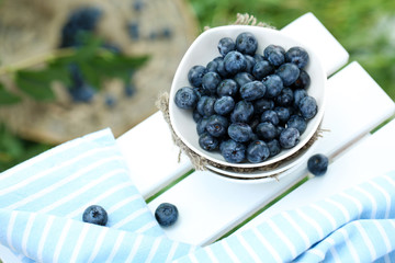Blueberries in plates near napkin