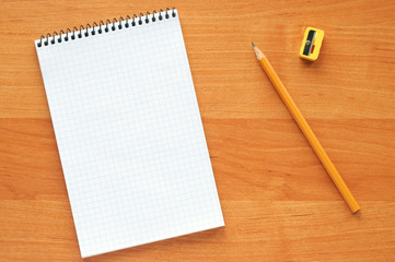 White blank notebook with pencil