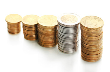 Many coins in columns isolated on white
