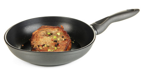 Piece of fried meat on pan isolated on white