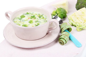 Cabbage soup in plate on napkin isolated on white