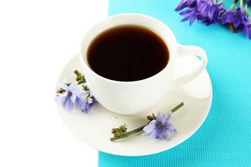 Cup of tea with chicory, isolated on white