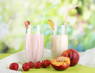 Delicious milk shakes with strawberries and peach