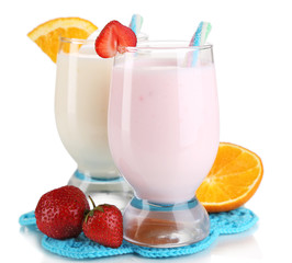 Delicious milk shakes with orange and strawberries isolated
