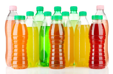 Assortment of bottles with tasty drinks, isolated on white