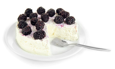 Cheesecake with fresh berries on white plate isolated on white