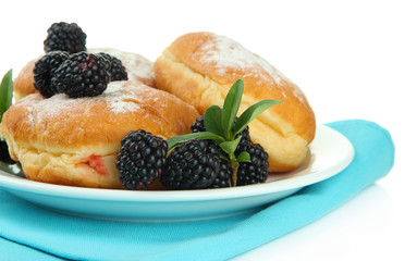 Tasty donuts with berries, isolated on white