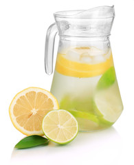 Cold water with lime, lemon and ice in pitcher isolated on