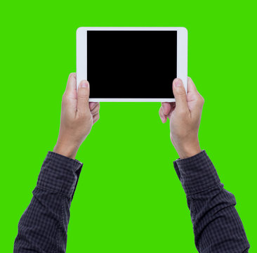 Man hands hold tablet pc on green background wite clipping path