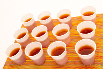 Disposable cups with tea