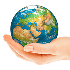 Hand of the person holds globe.