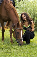 Woman posing with horse