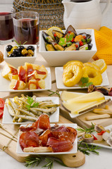 Spanish Cuisine. Variety of tapas on white plates.