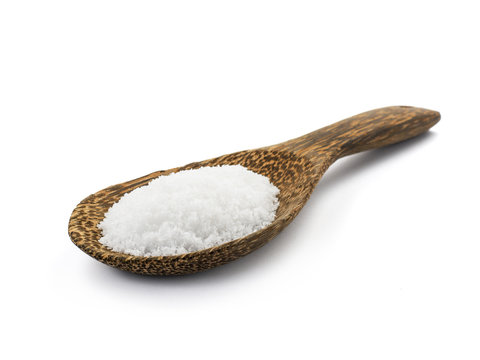 Salt with wooden spoon isolated on white background