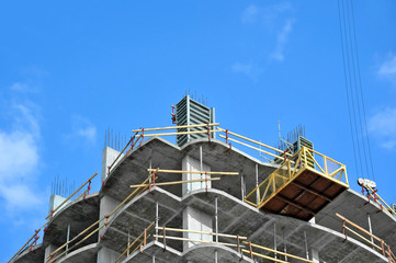 Building construction site work against blue sky