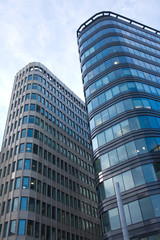Fototapeta na wymiar High modern office buildings in a city over blue sky close up